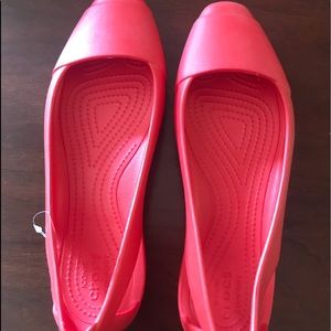 Croc closed toe sandals.